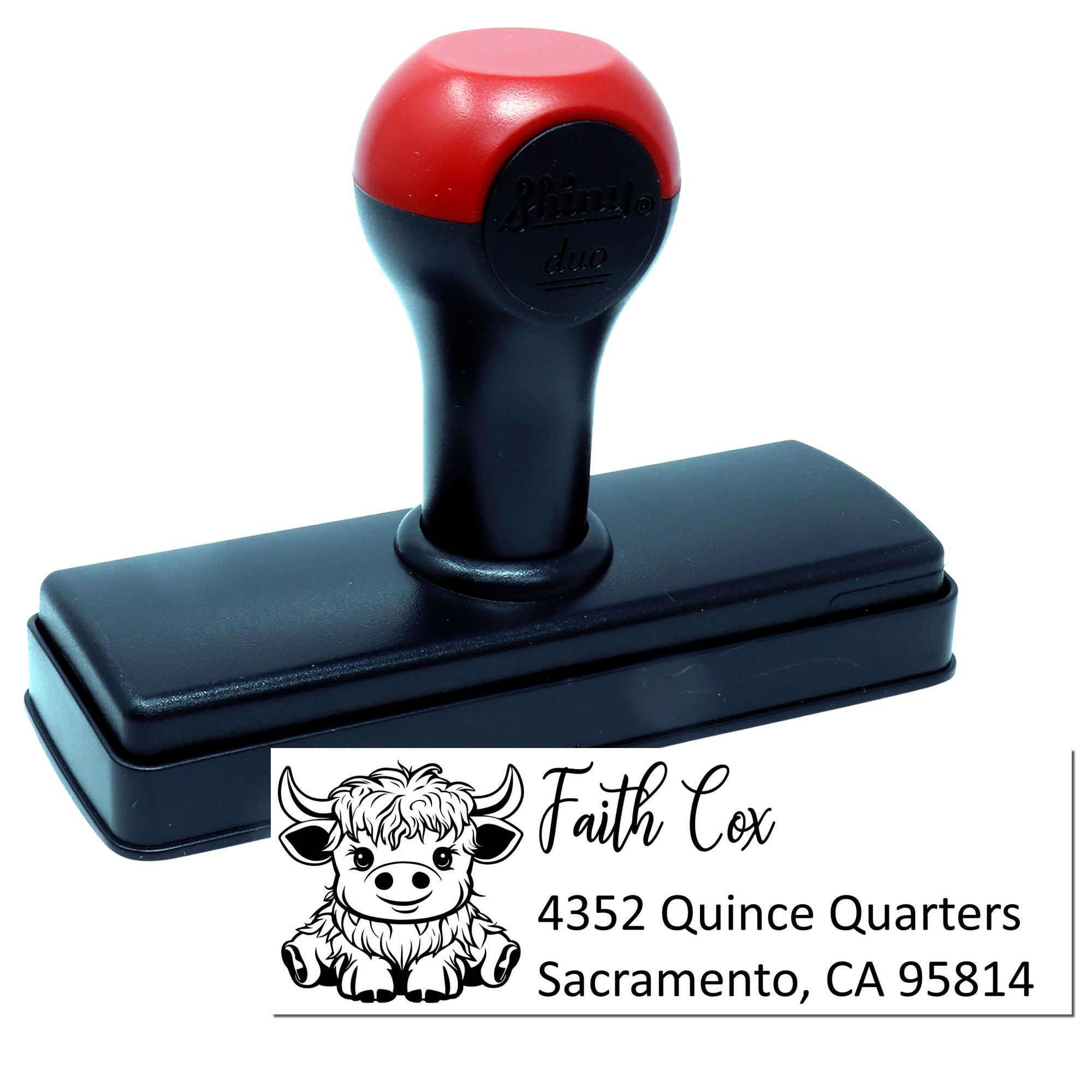 Custom self-inking rubber address stamp with cow logo, name, and Sacramento address for personalized mailing use.
