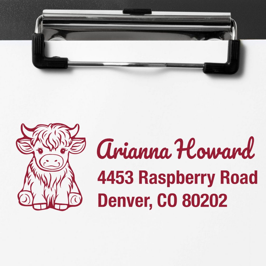 Custom rubber address stamp with cow design for Arianna Howard, 4453 Raspberry Road, Denver, CO 80202.