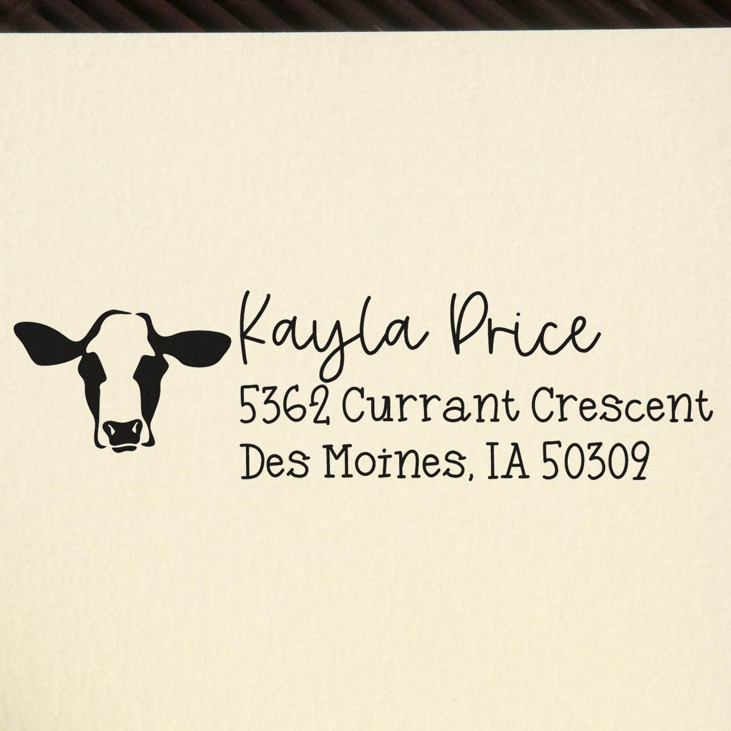 Custom rubber address stamp with cow logo for Kayla Price, Des Moines, IA 50309