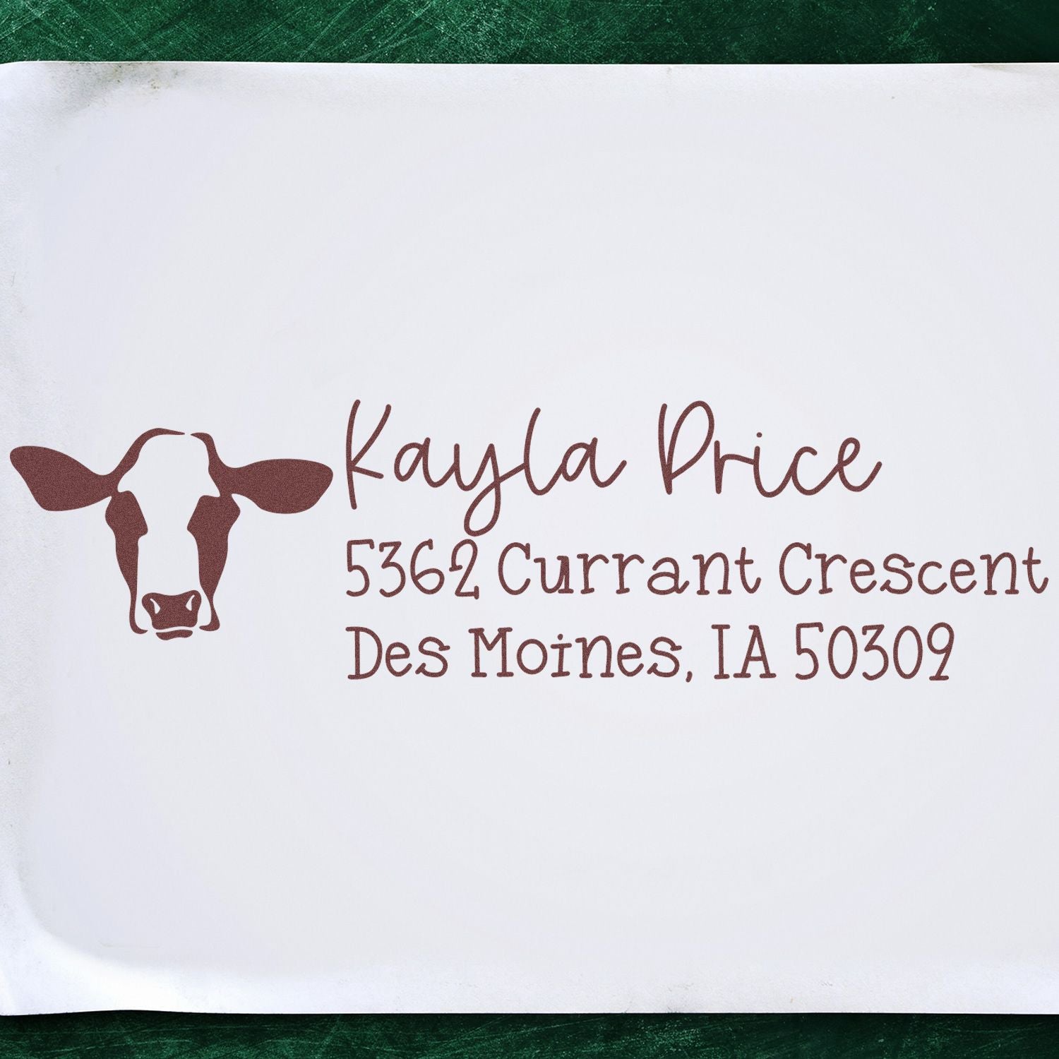 Custom cow address rubber stamp with Kayla Price name and Des Moines, IA return address.