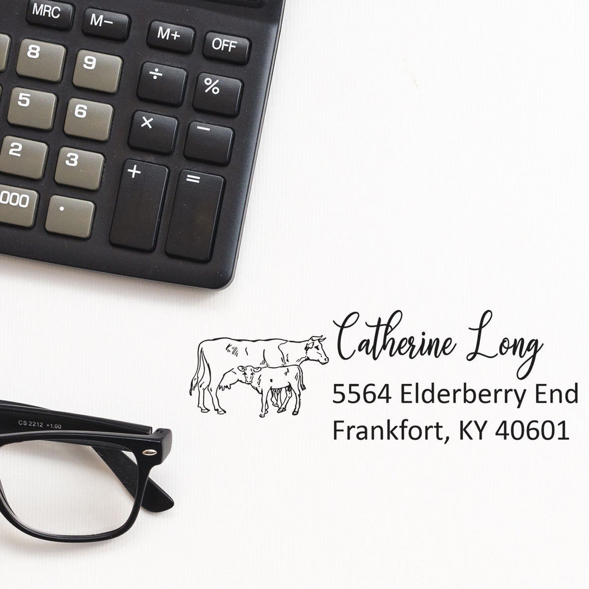 Custom return address rubber stamp with cow design, name, and address for farm business mailings