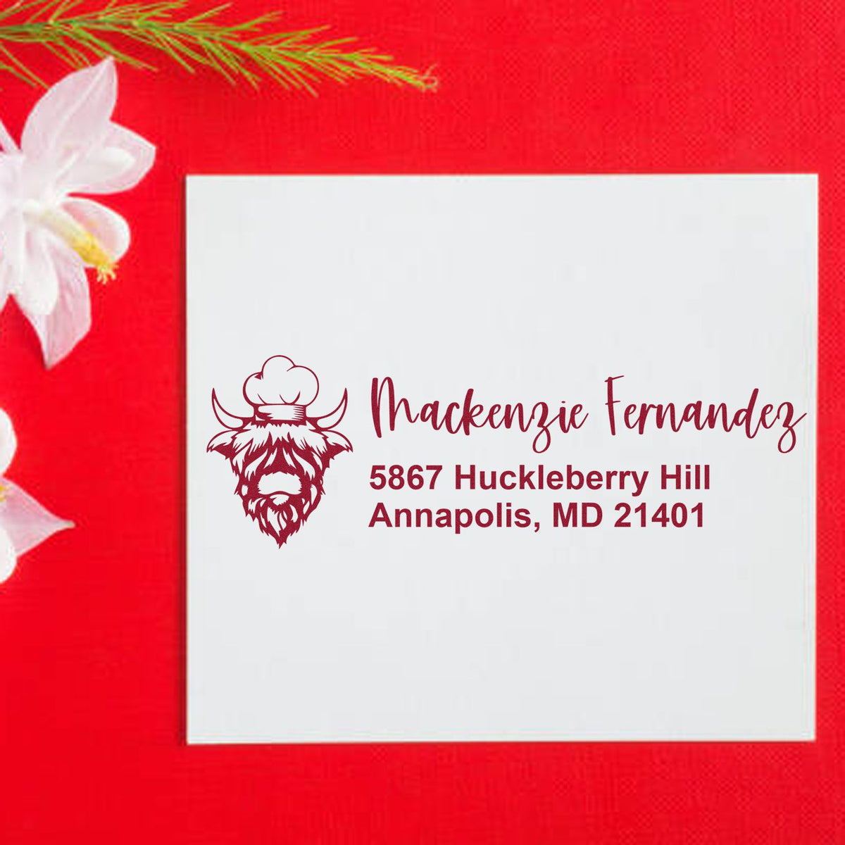 Custom return address rubber stamp with bull logo for Mackenzie Fernandez, 5867 Huckleberry Hill, Annapolis, MD 21401.