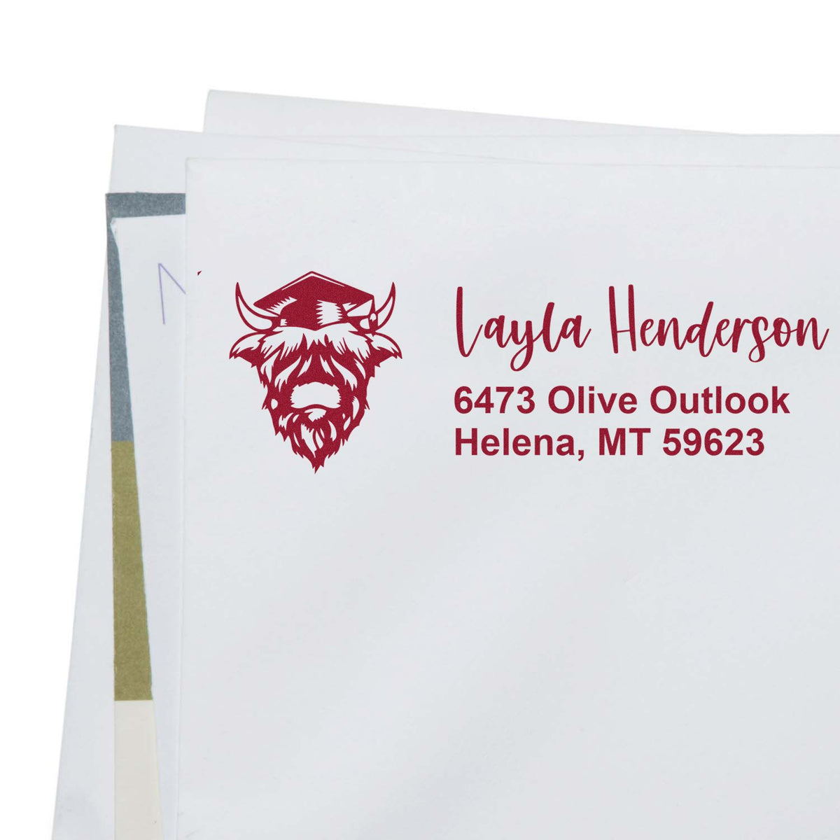 Custom address rubber stamp with buffalo logo for envelopes, featuring Layla Henderson, Helena, MT return address.