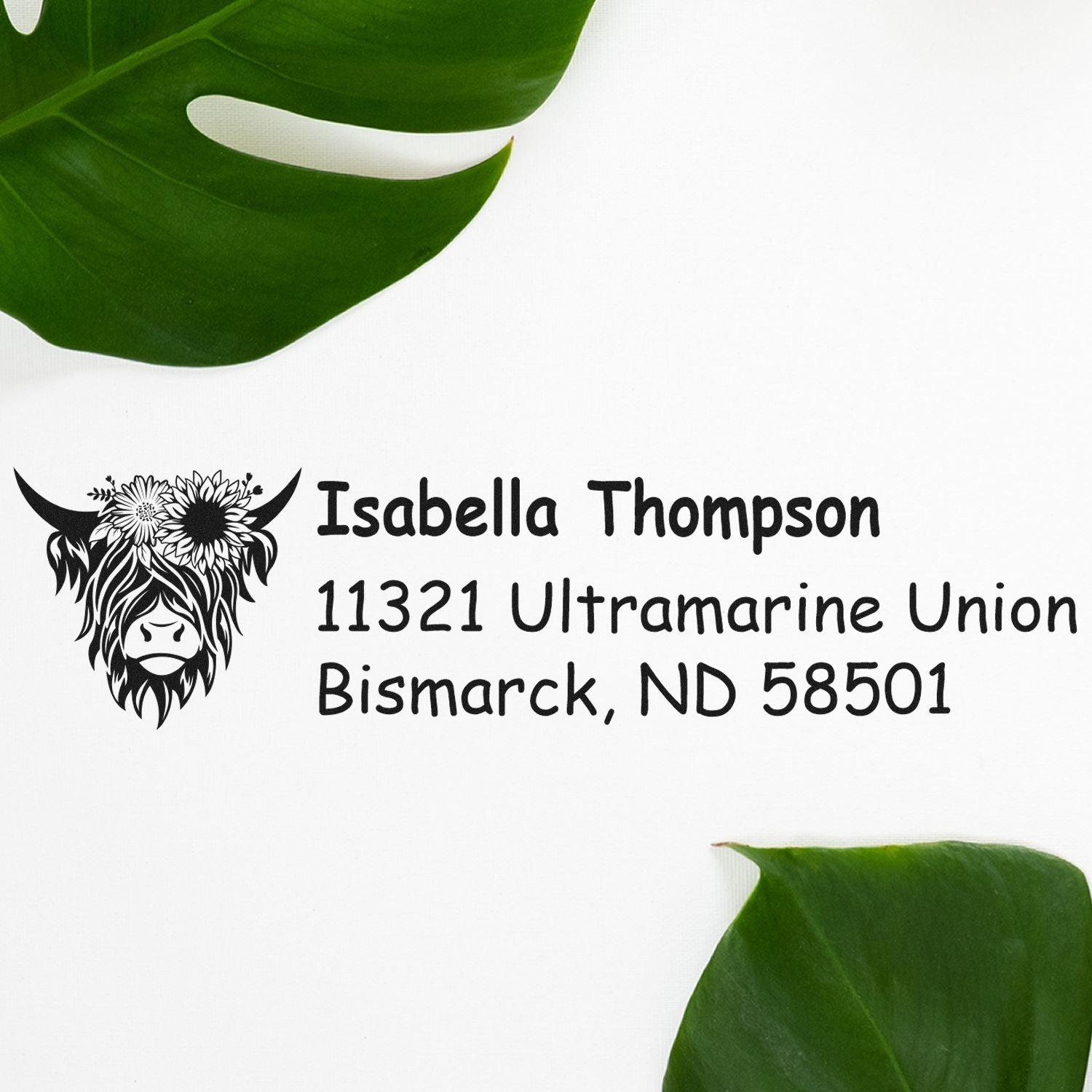 Custom return address rubber stamp with cow floral design for Isabella Thompson, 11321 Ultramarine Union, Bismarck, ND 58501