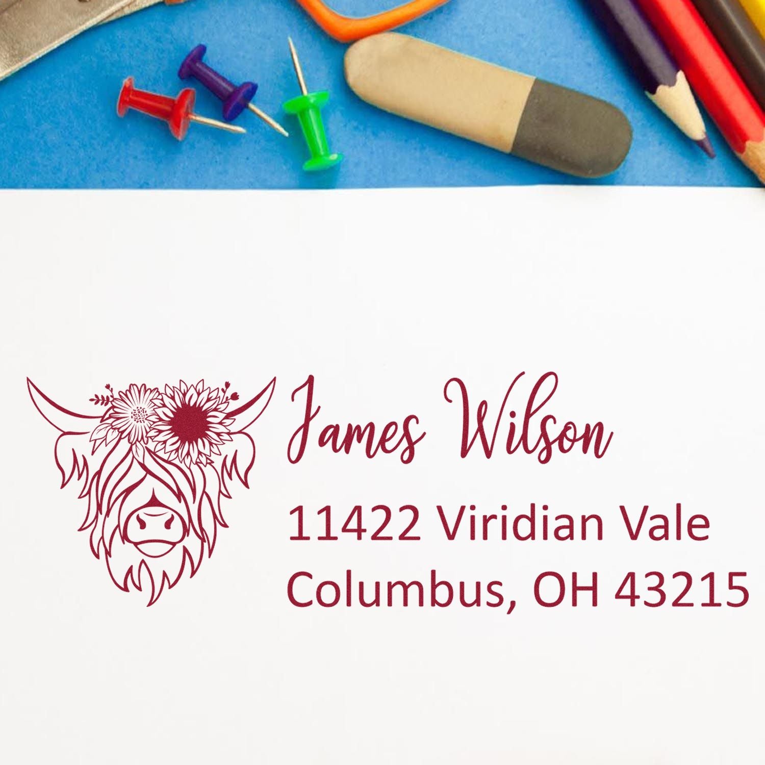 Custom return address rubber stamp with floral cow design, James Wilson name, and Columbus, OH mailing address.