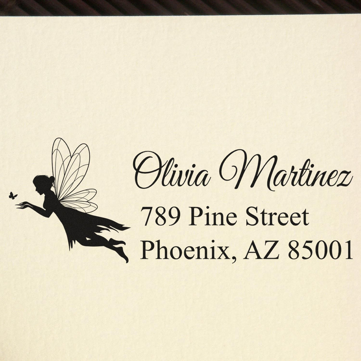 Personalized rubber address stamp with fairy silhouette, Olivia Martinez, 789 Pine Street, Phoenix, AZ 85001.