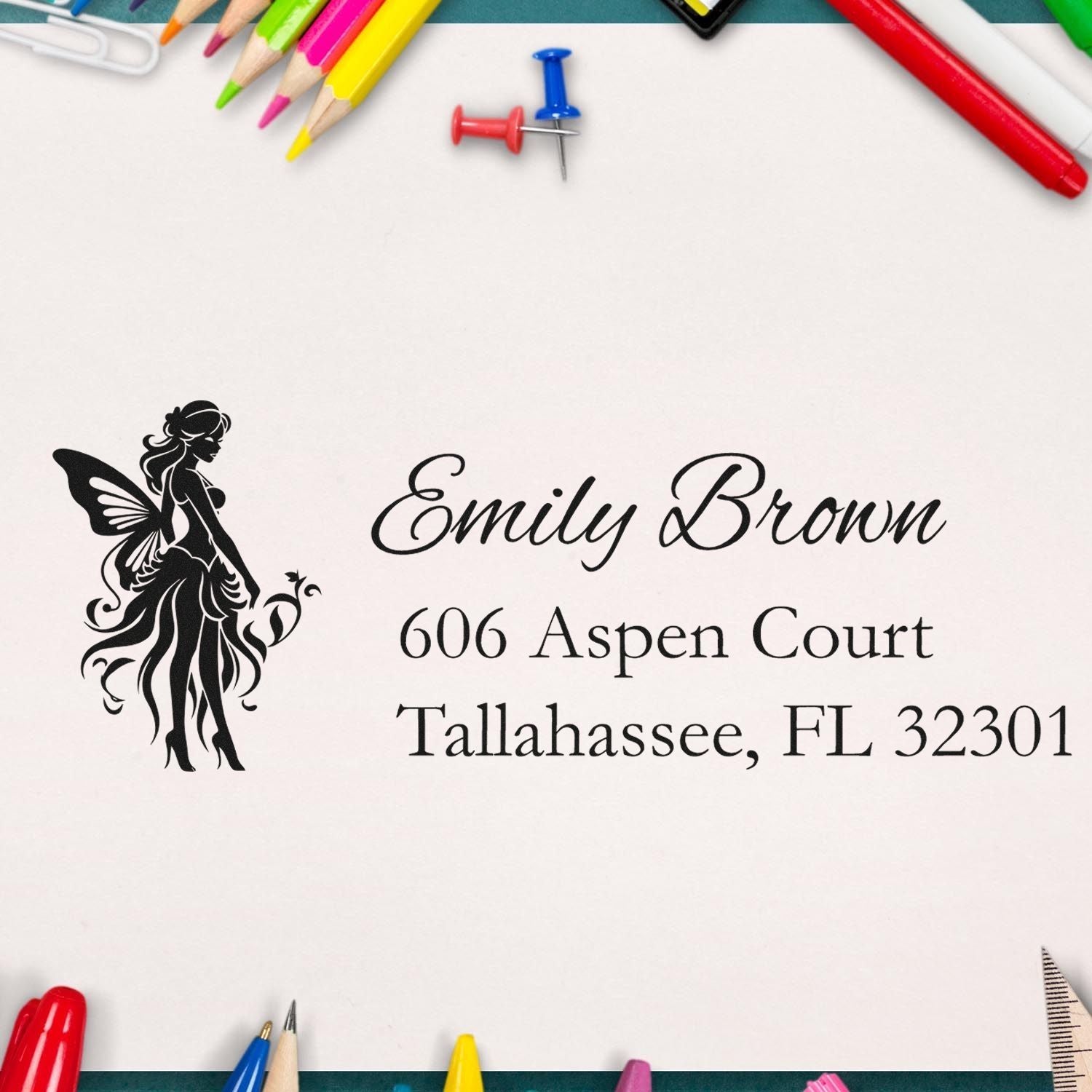 Custom return address rubber stamp with fairy design for Emily Brown, Tallahassee, FL 32301.