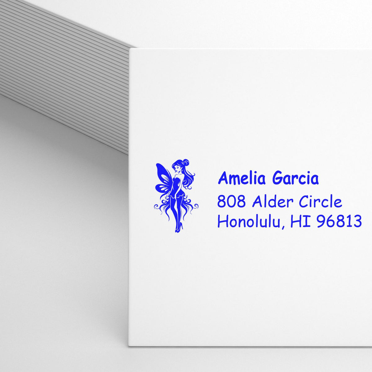 Custom return address rubber stamp with fairy design for Amelia Garcia, Honolulu, HI 96813.