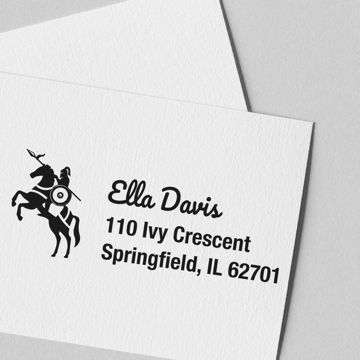 Custom return address rubber stamp for envelopes, featuring knight logo, Ella Davis, Springfield, IL 62701.