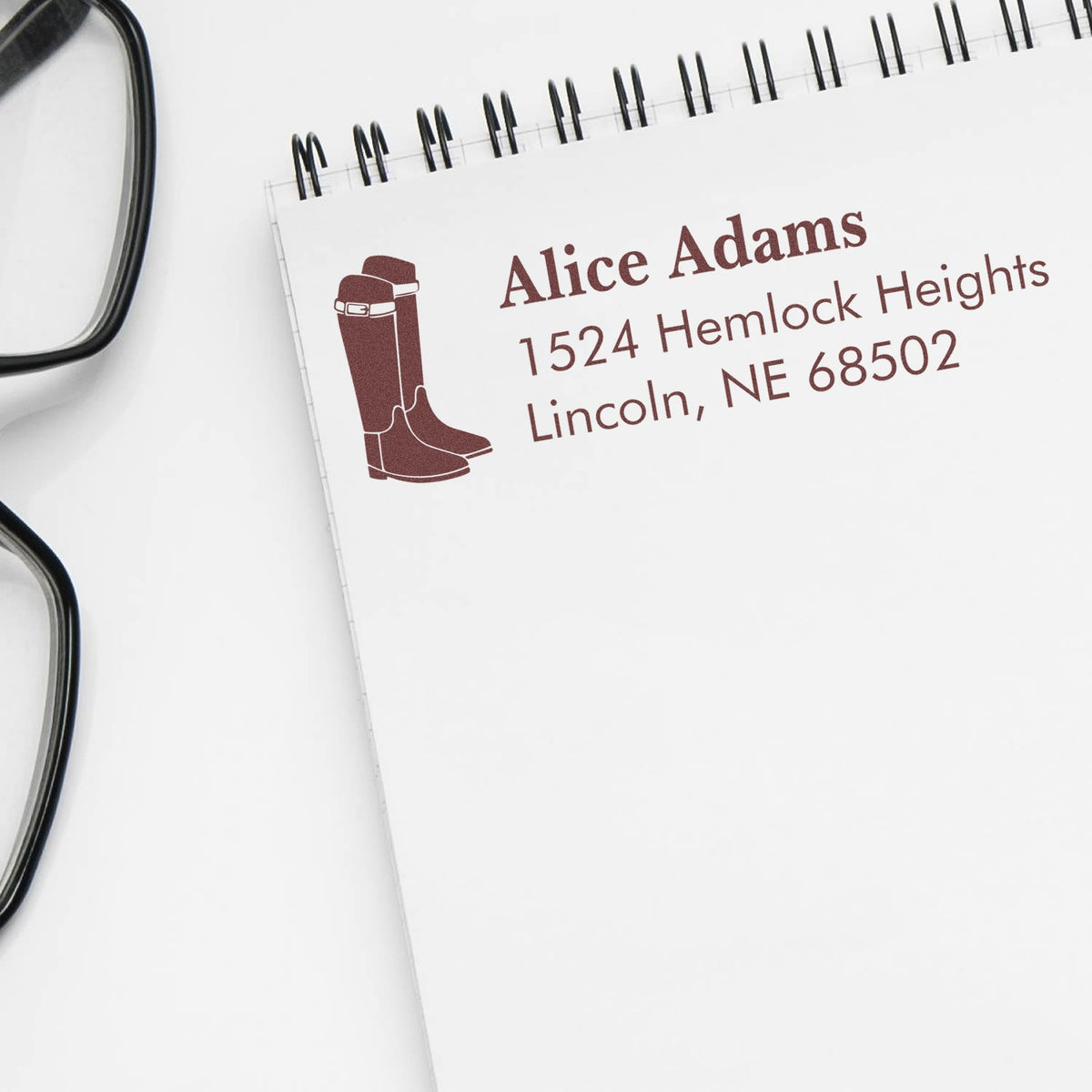 Custom rubber address stamp with boots icon and Alice Adams return address, Lincoln, NE.