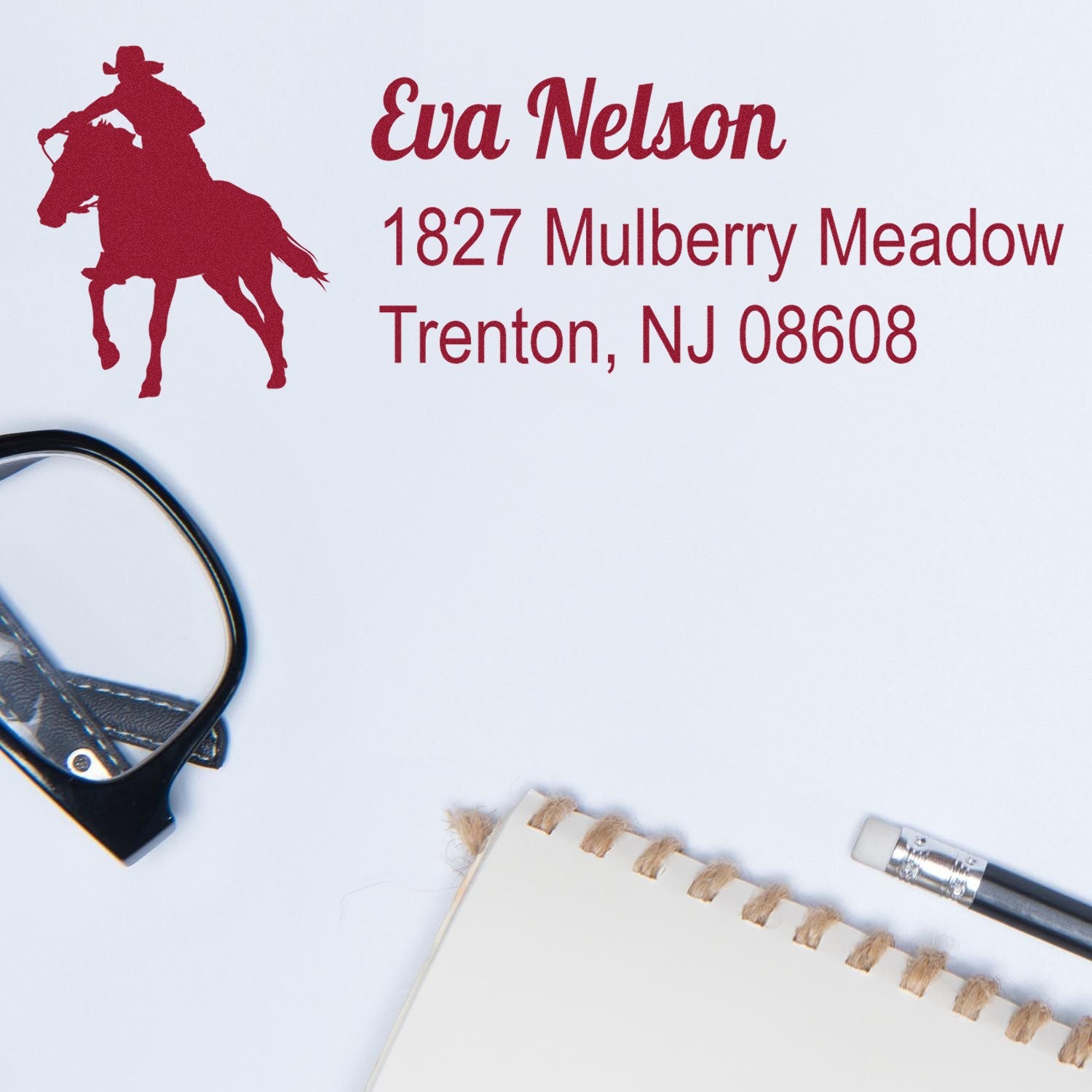 Personalized rubber stamp featuring horseback rider silhouette and return address for Eva Nelson, Trenton, NJ 08608.
