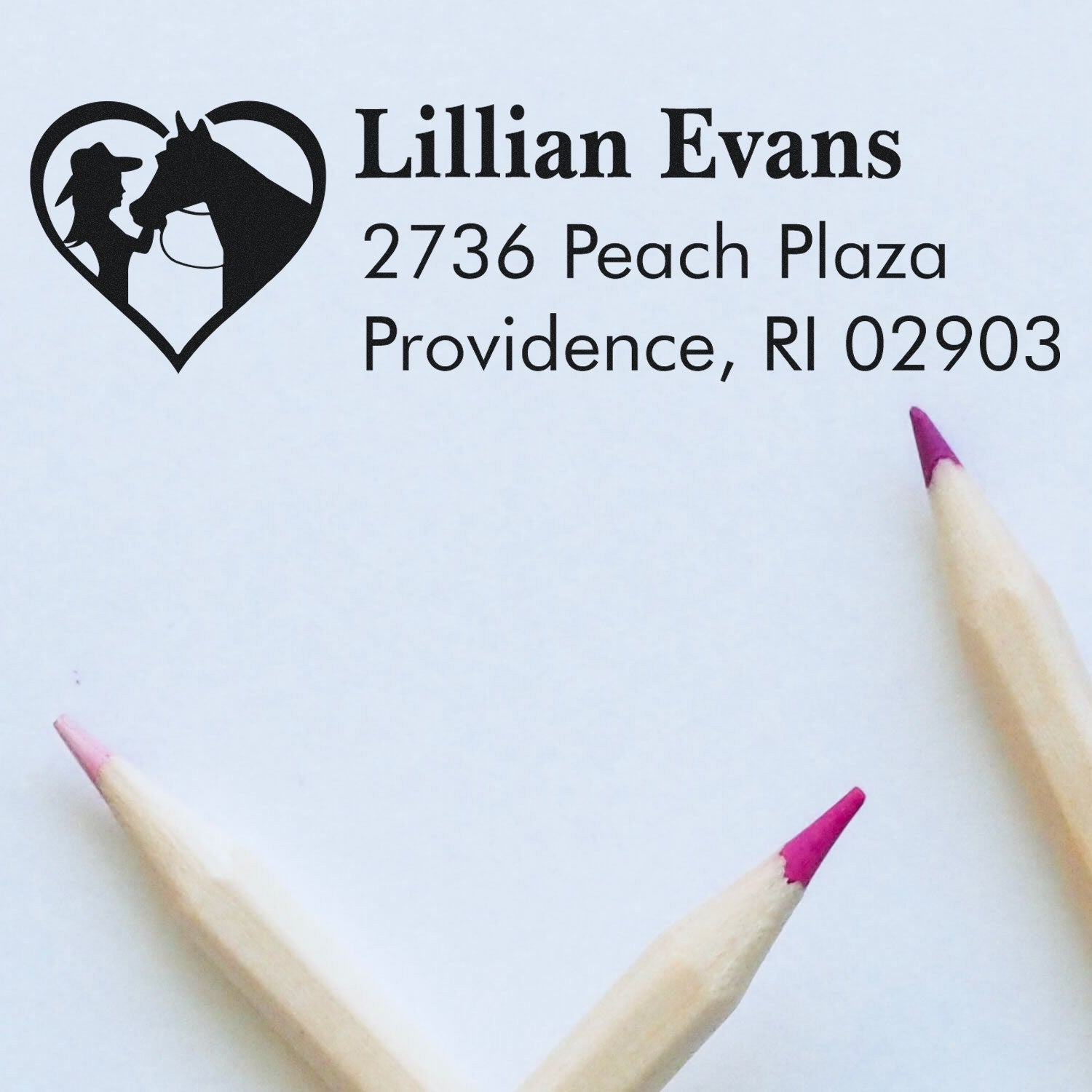 Custom rubber address stamp with horse heart logo for Lillian Evans, 2736 Peach Plaza, Providence, RI 02903.