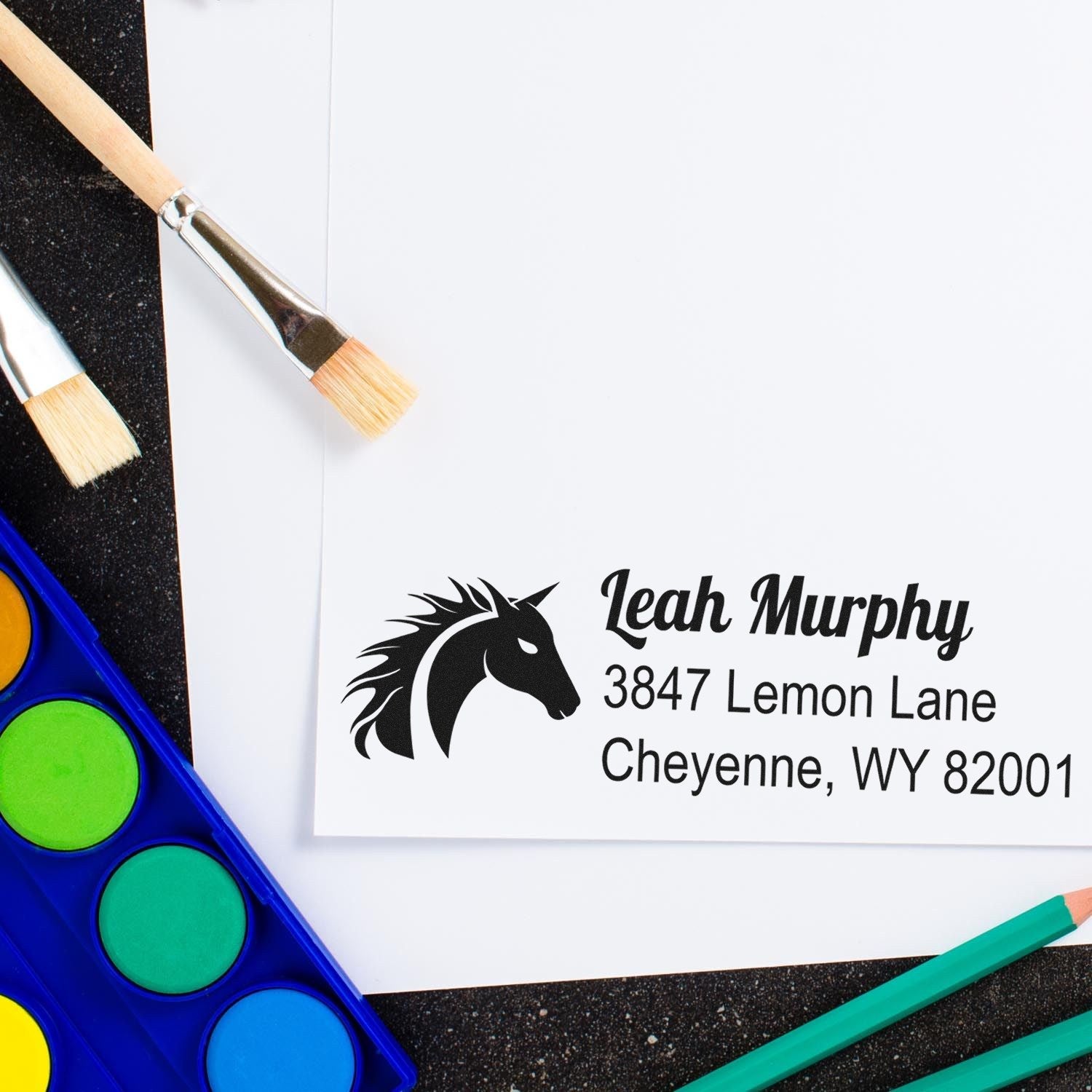 Personalized horse head address rubber stamp impression with Leah Murphy name and Cheyenne, WY mailing details.