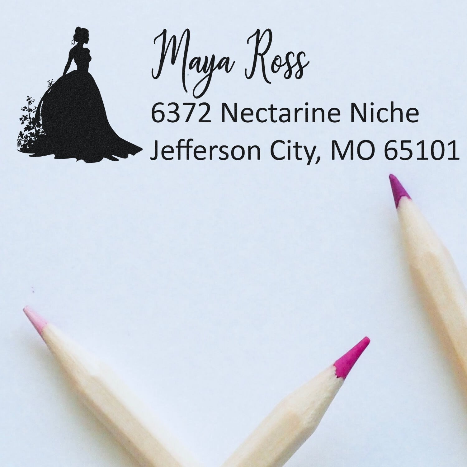 Custom return address rubber stamp featuring elegant woman silhouette for Maya Ross, Jefferson City, MO 65101.