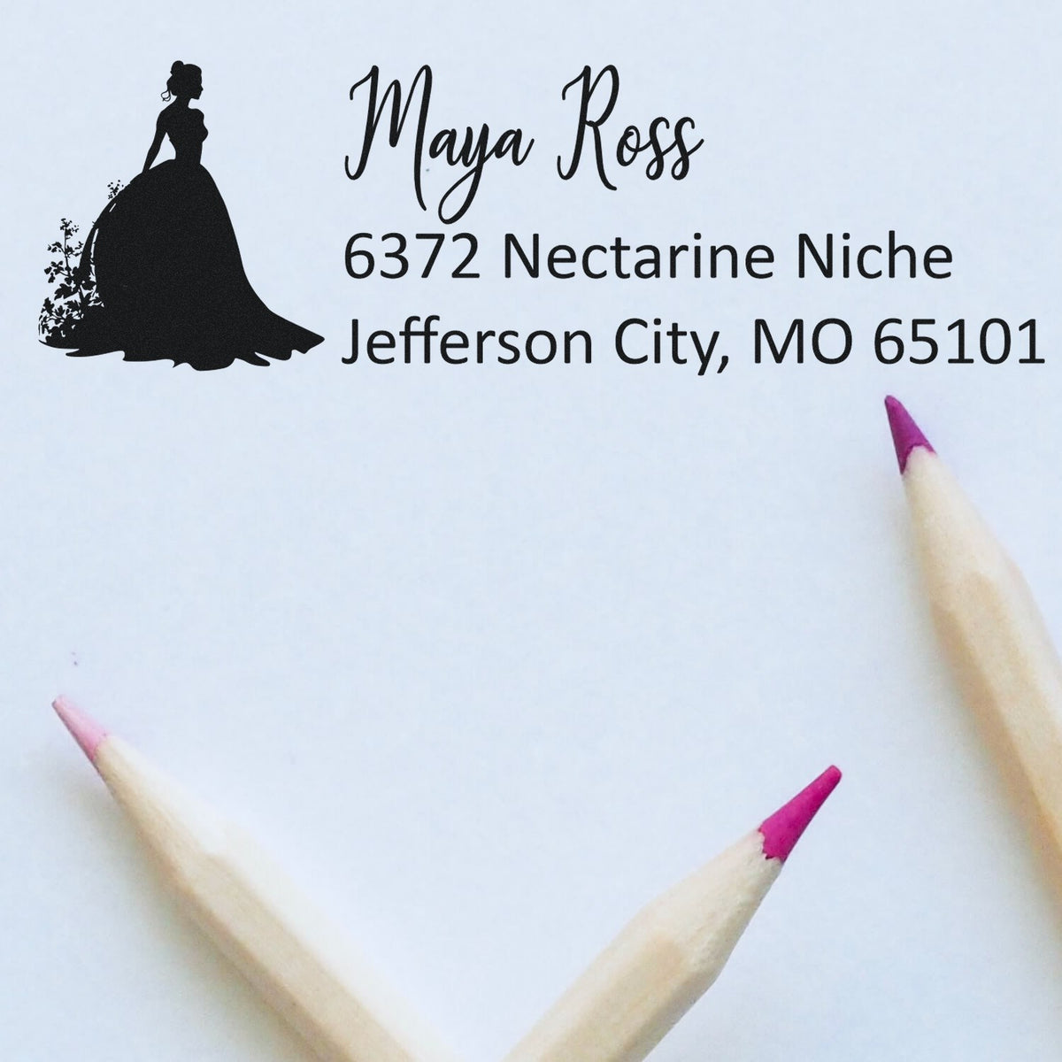 Custom return address rubber stamp with woman silhouette, Maya Ross, and Jefferson City, MO 65101.