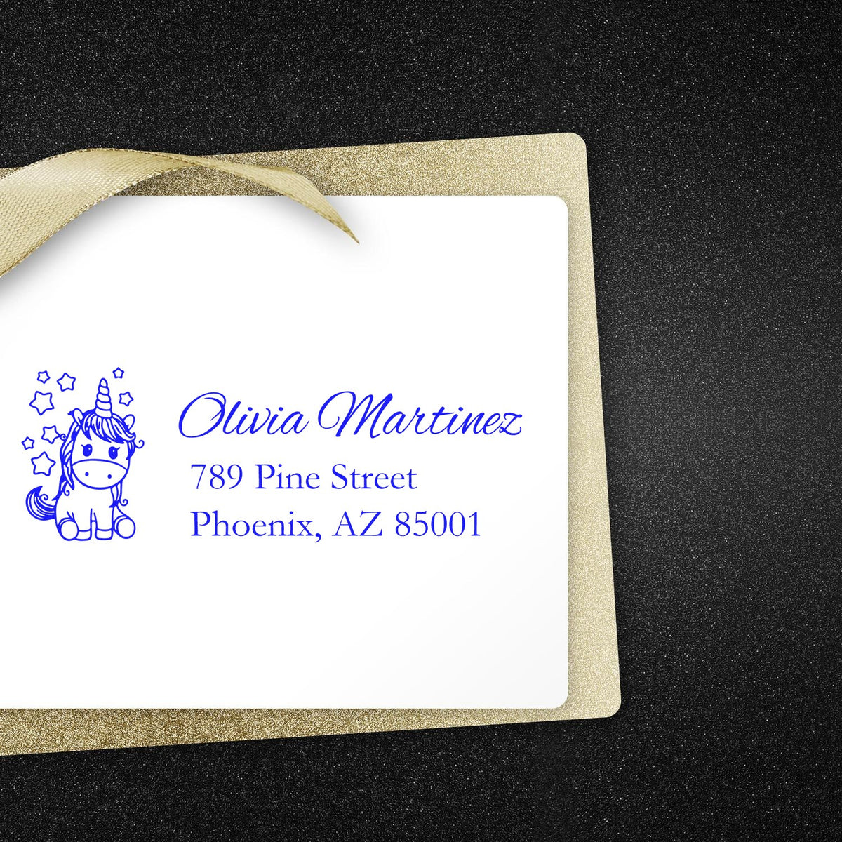 Custom unicorn address rubber stamp with blue ink name and address for envelopes, invitations, and gift packaging.