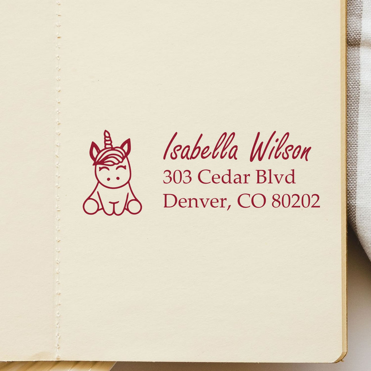 Custom unicorn return address rubber stamp with name and Denver, CO mailing address for envelopes.