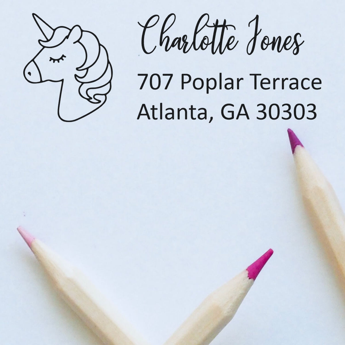 Personalized unicorn return address rubber stamp for Charlotte Jones, 707 Poplar Terrace, Atlanta, GA 30303