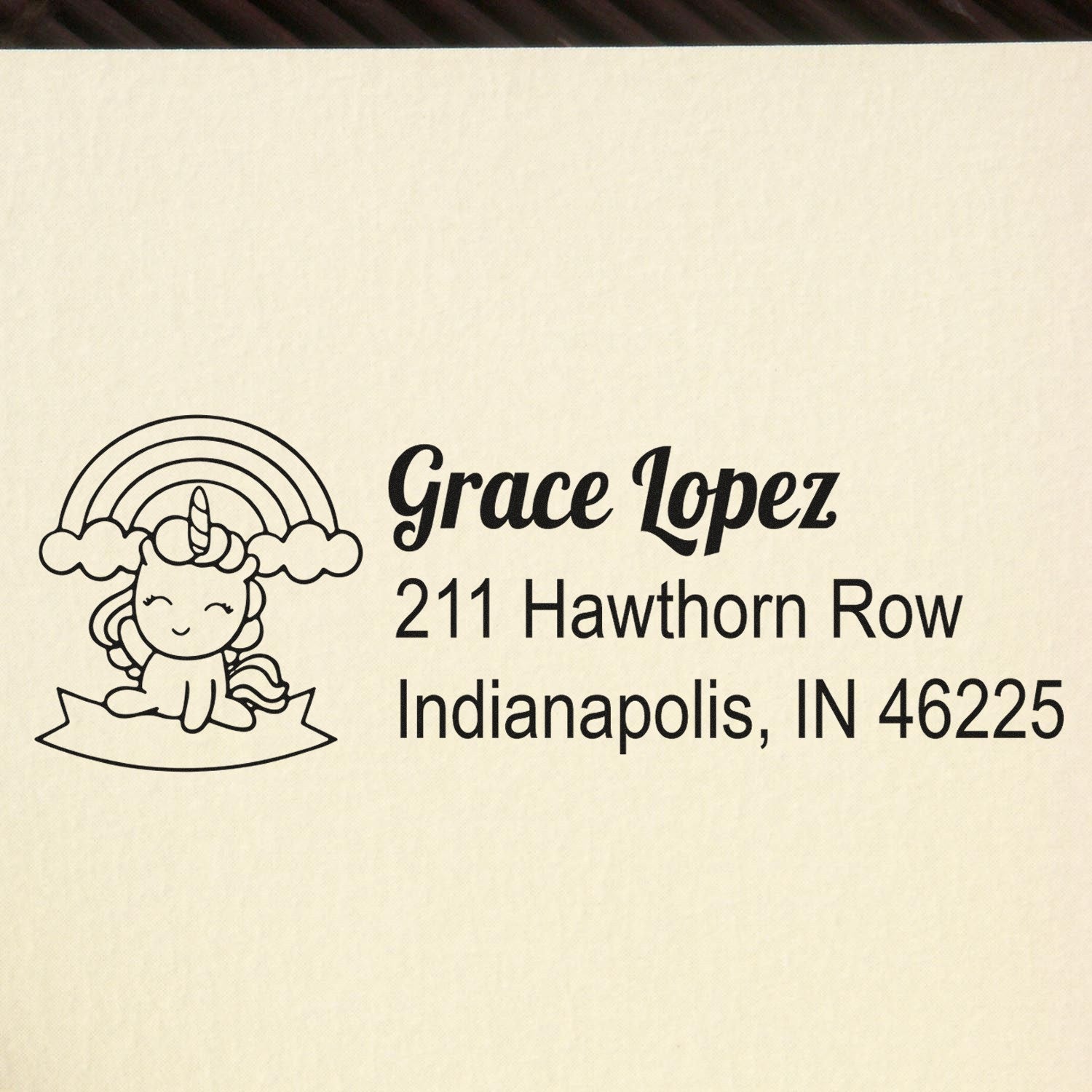 Custom return address rubber stamp with unicorn and rainbow design for Grace Lopez, Indianapolis, IN 46225.