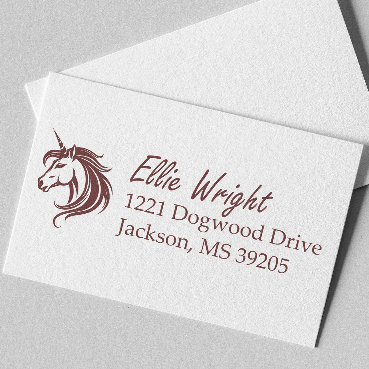 Custom unicorn return address rubber stamp for Ellie Wright, 1221 Dogwood Drive, Jackson, MS 39205.