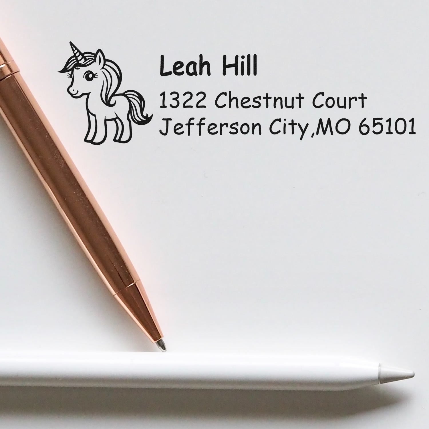 Custom unicorn return address rubber stamp with Leah Hill name and Jefferson City, MO address for personalized mail.