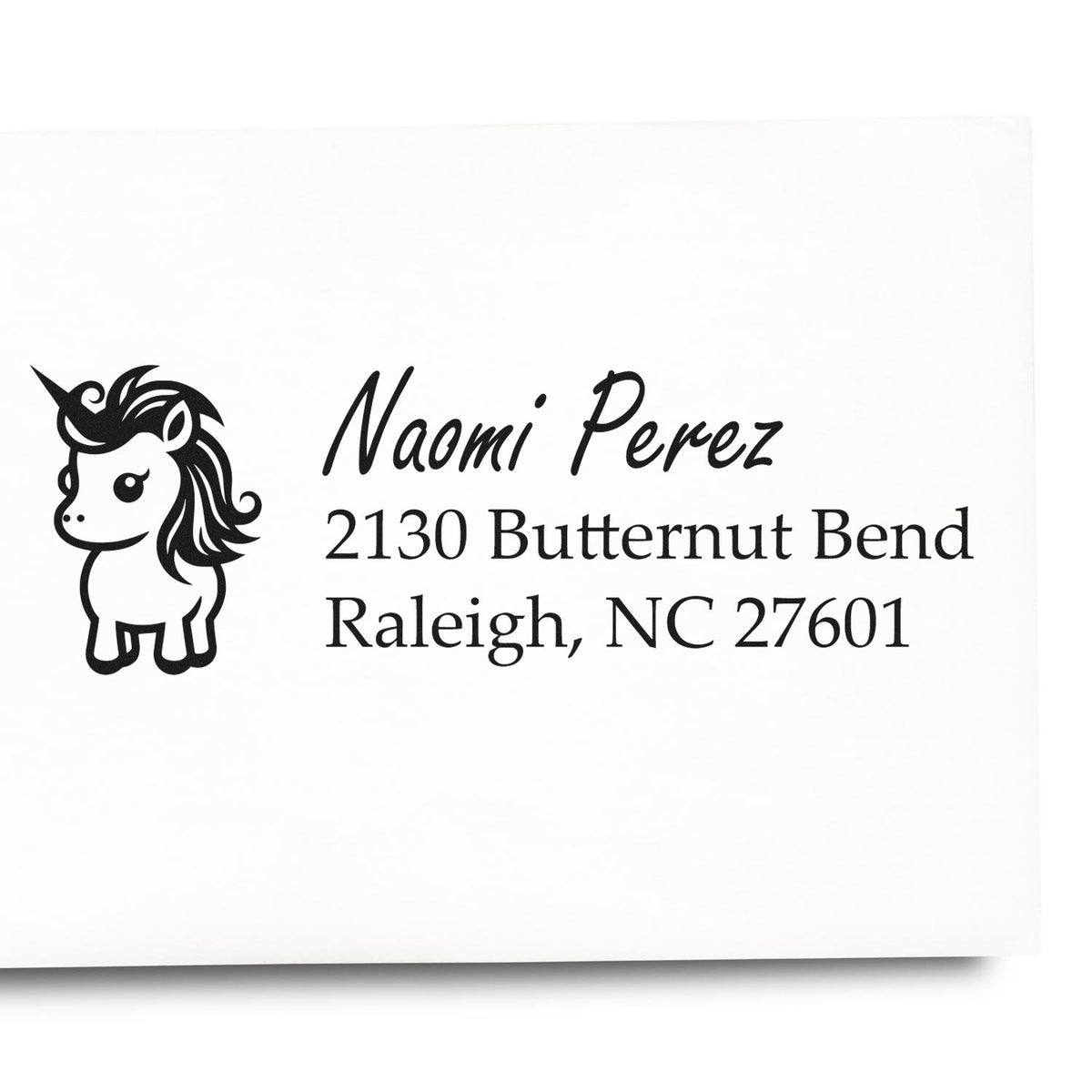 Custom unicorn address stamp for Naomi Perez, 2130 Butternut Bend, Raleigh, NC 27601.