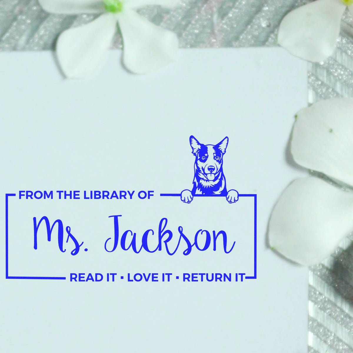 Personalized rubber library stamp for Ms. Jackson featuring a dog icon and Read It, Love It, Return It book message.