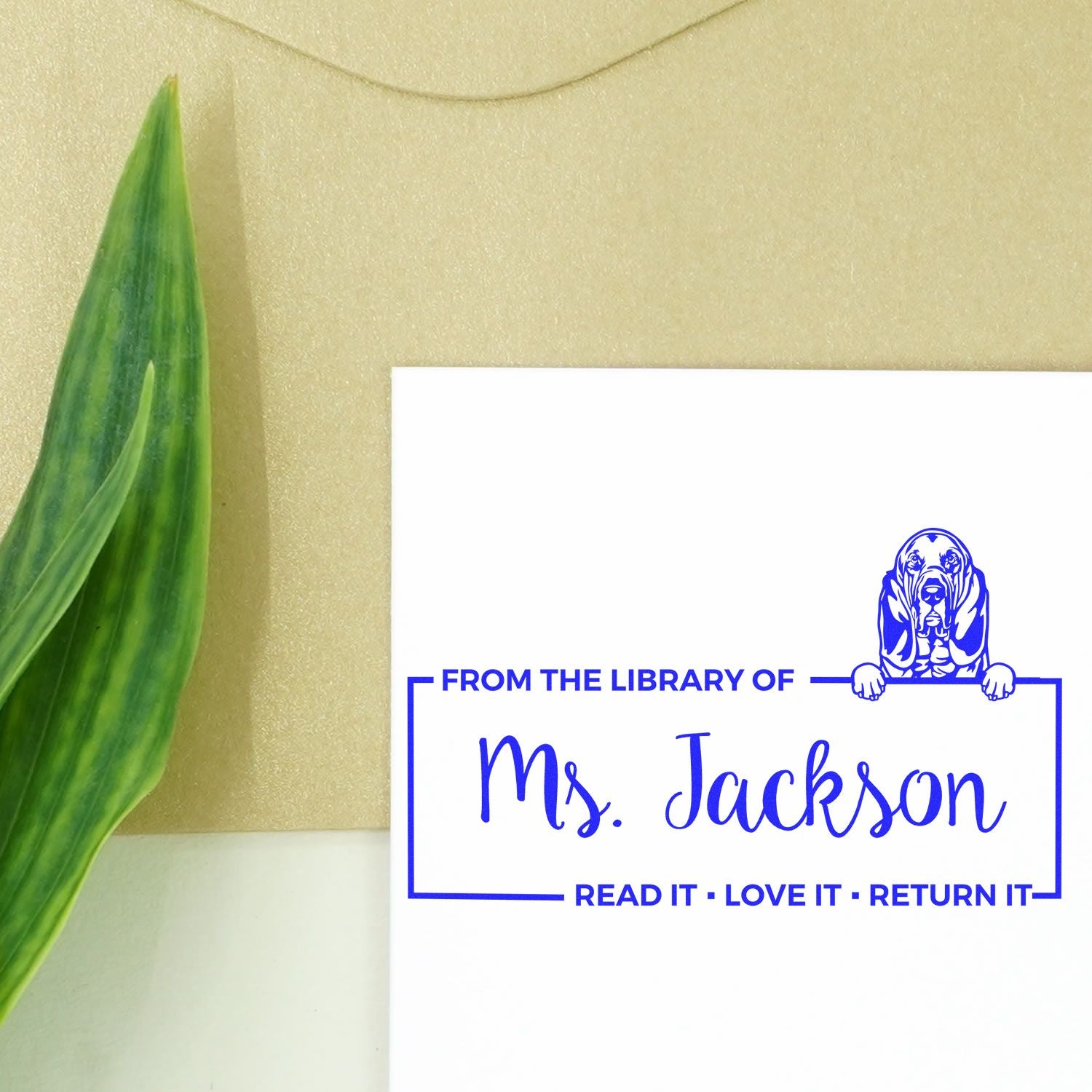 Custom rubber library stamp for Ms. Jackson with dog design and From the Library Of return message.