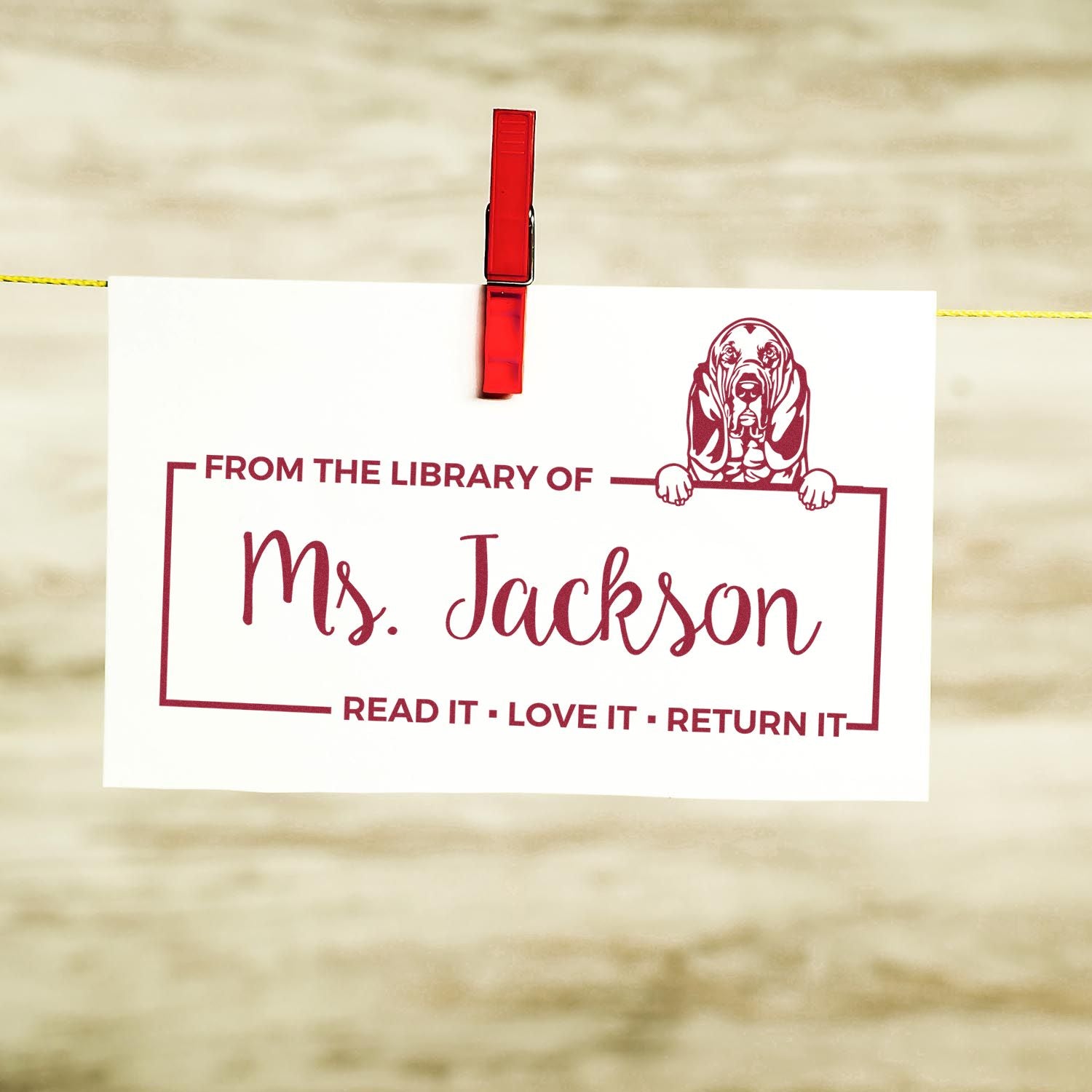 Personalized library rubber stamp for Ms. Jackson with basset hound design and Read It, Love It, Return It message