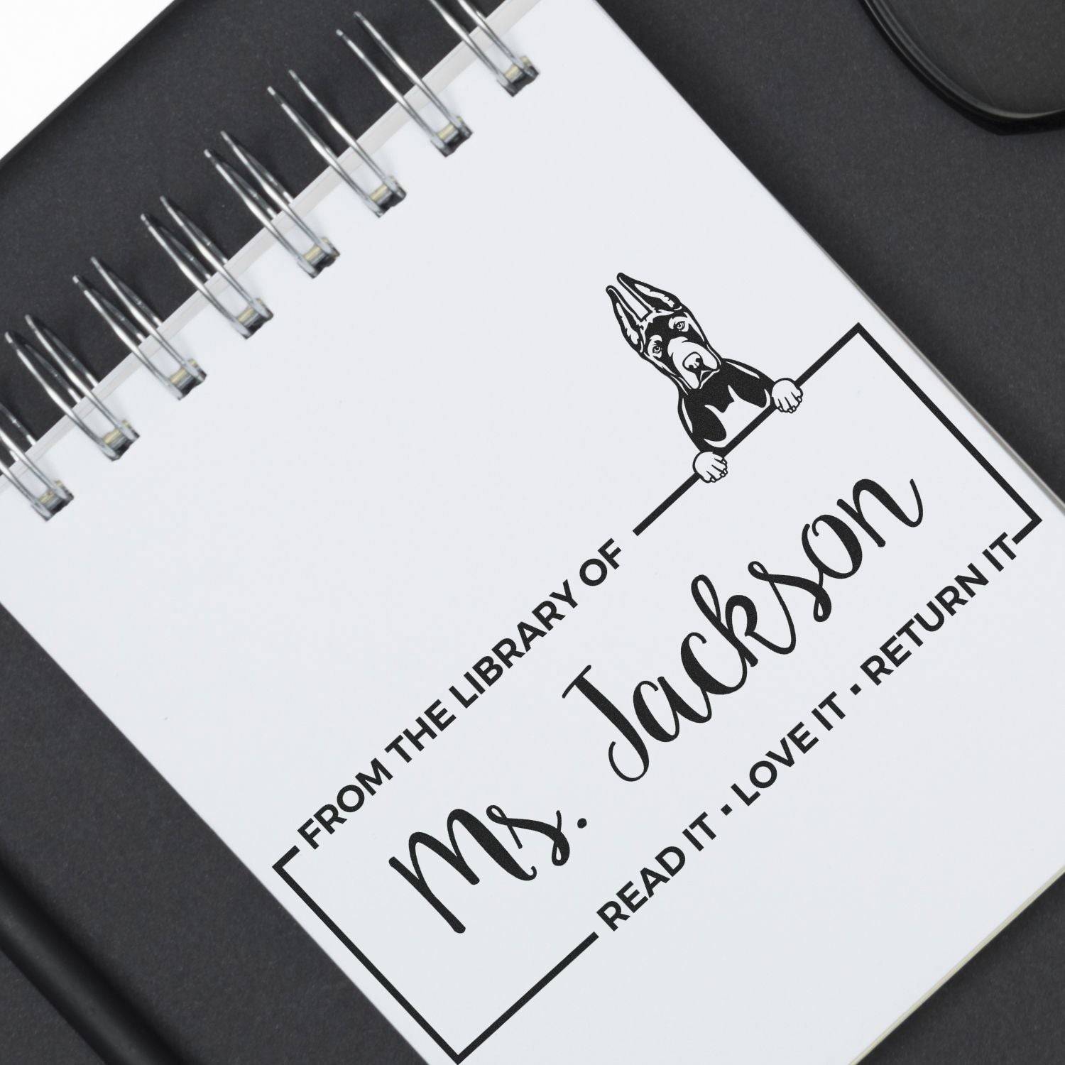 Personalized rubber book stamp with dog design: From the Library of Ms. Jackson, Read It, Love It, Return It.