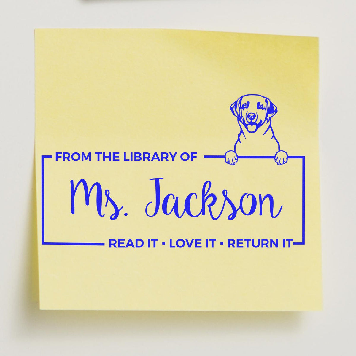 Personalized rubber library stamp for Ms. Jackson with dog illustration and Read it, love it, return it bookplate text.