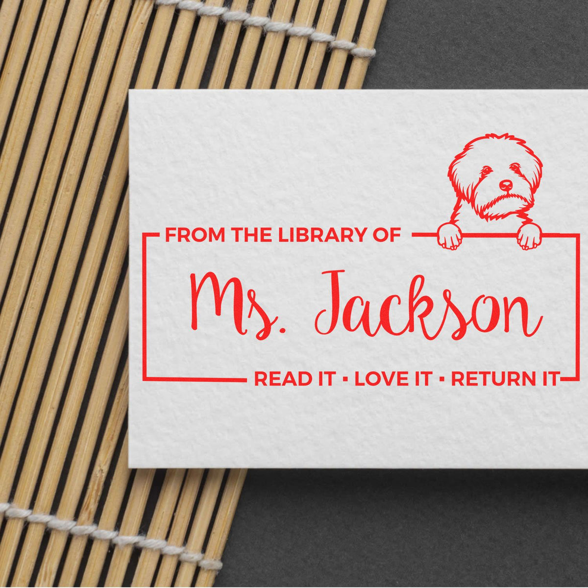 Custom library book stamp for Mrs. Jackson with dog design and Read It, Love It, Return It message.