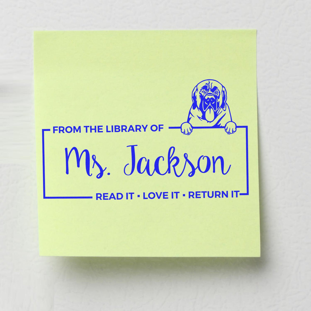 Personalized dog library rubber stamp for Ms. Jackson with From the Library Of and Read it, love it, return it text.