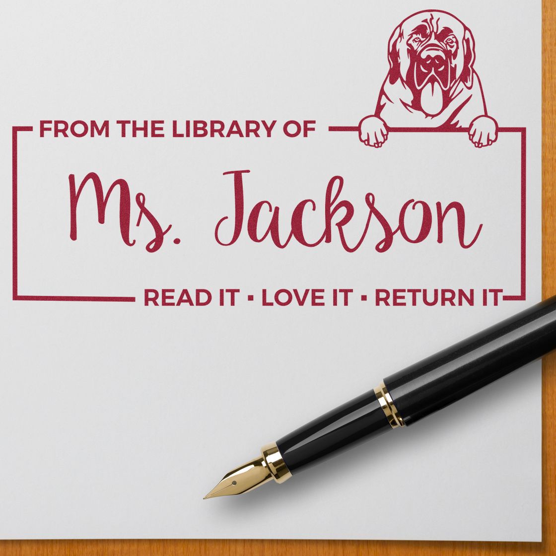 Personalized library rubber stamp for Ms. Jackson with dog design and Read it, love it, return it bookplate text.