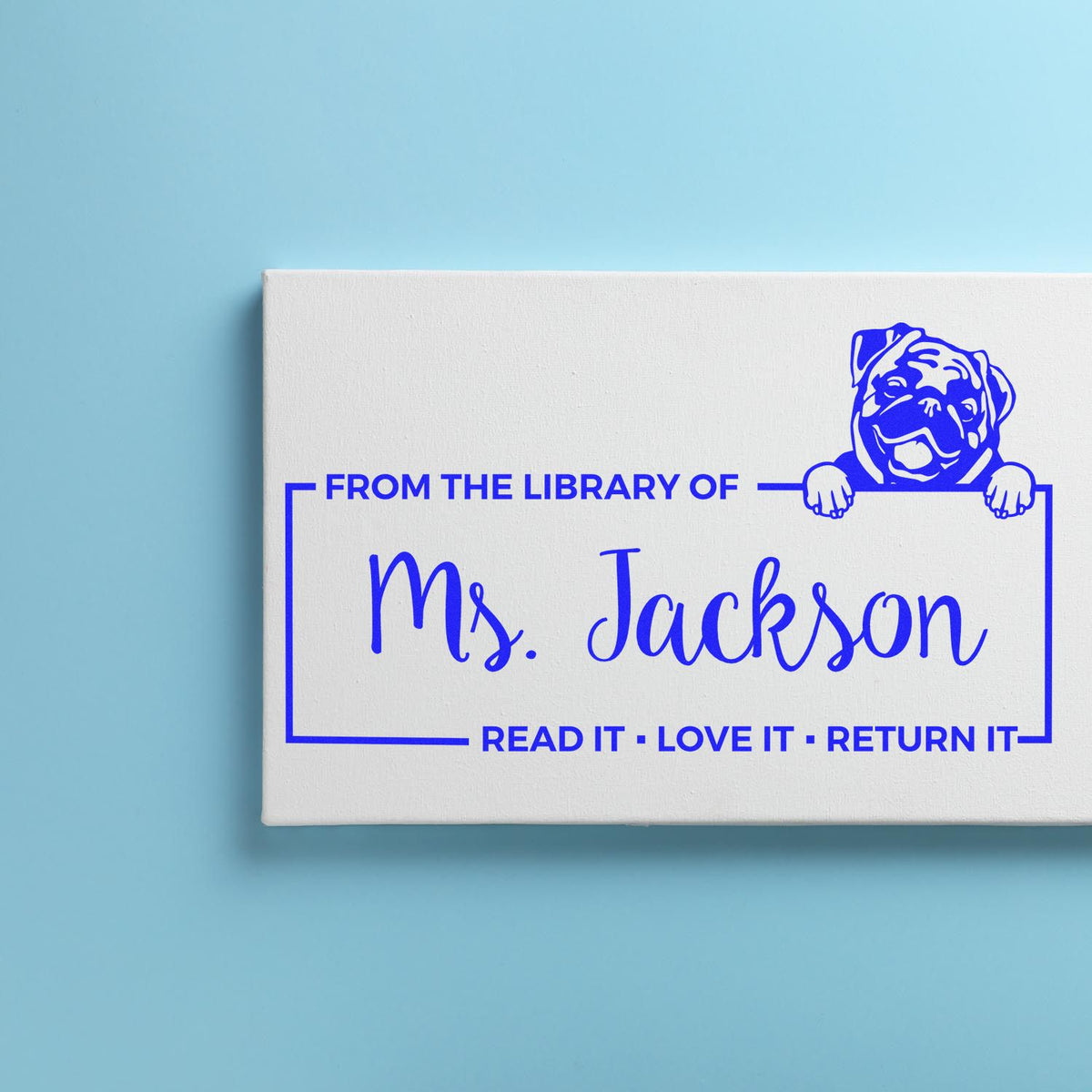 Custom rubber stamp for library books featuring From the Library of Ms. Jackson with bulldog art and Read it, love it, return it.