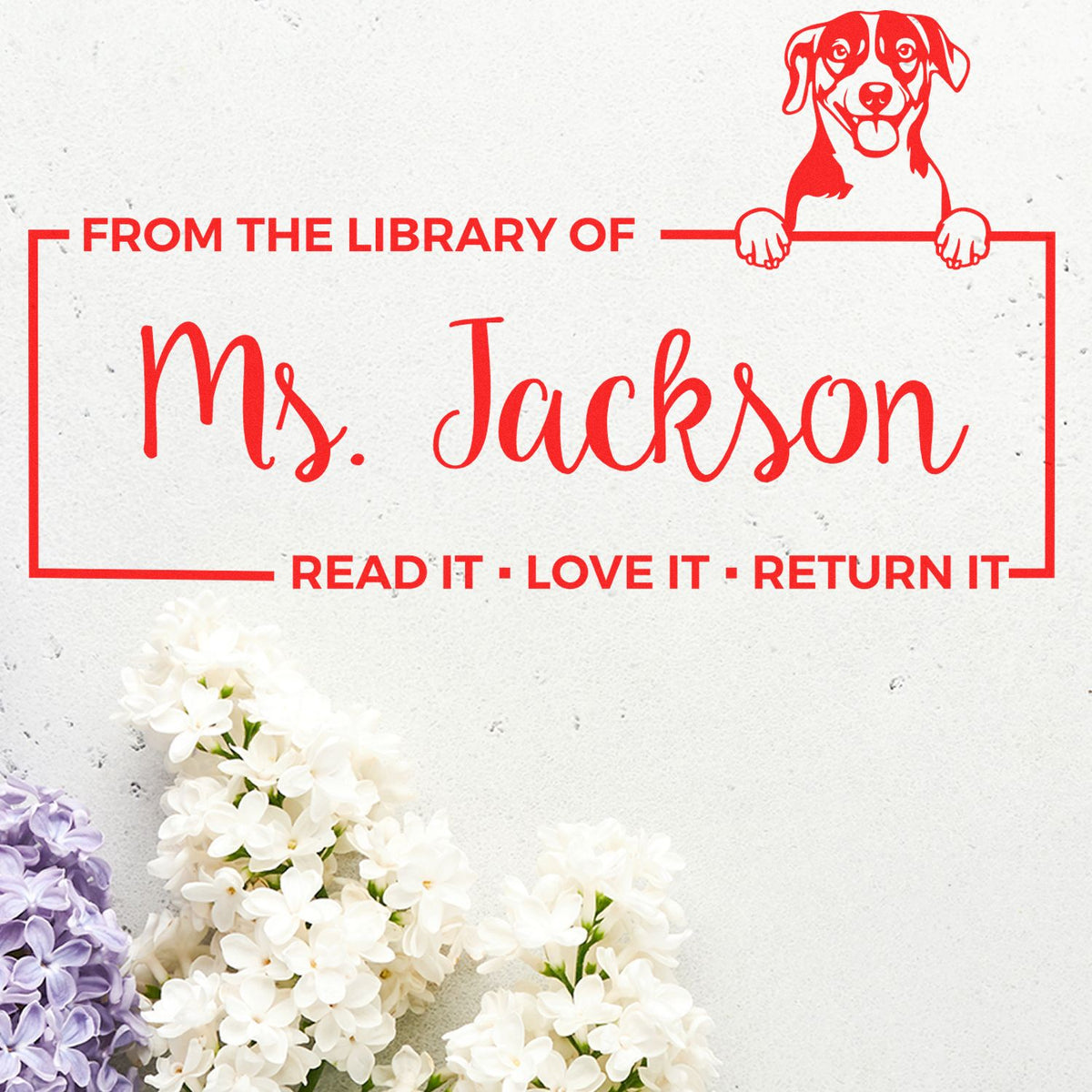 Personalized library rubber stamp with dog design and From the Library of Ms. Jackson return book message.