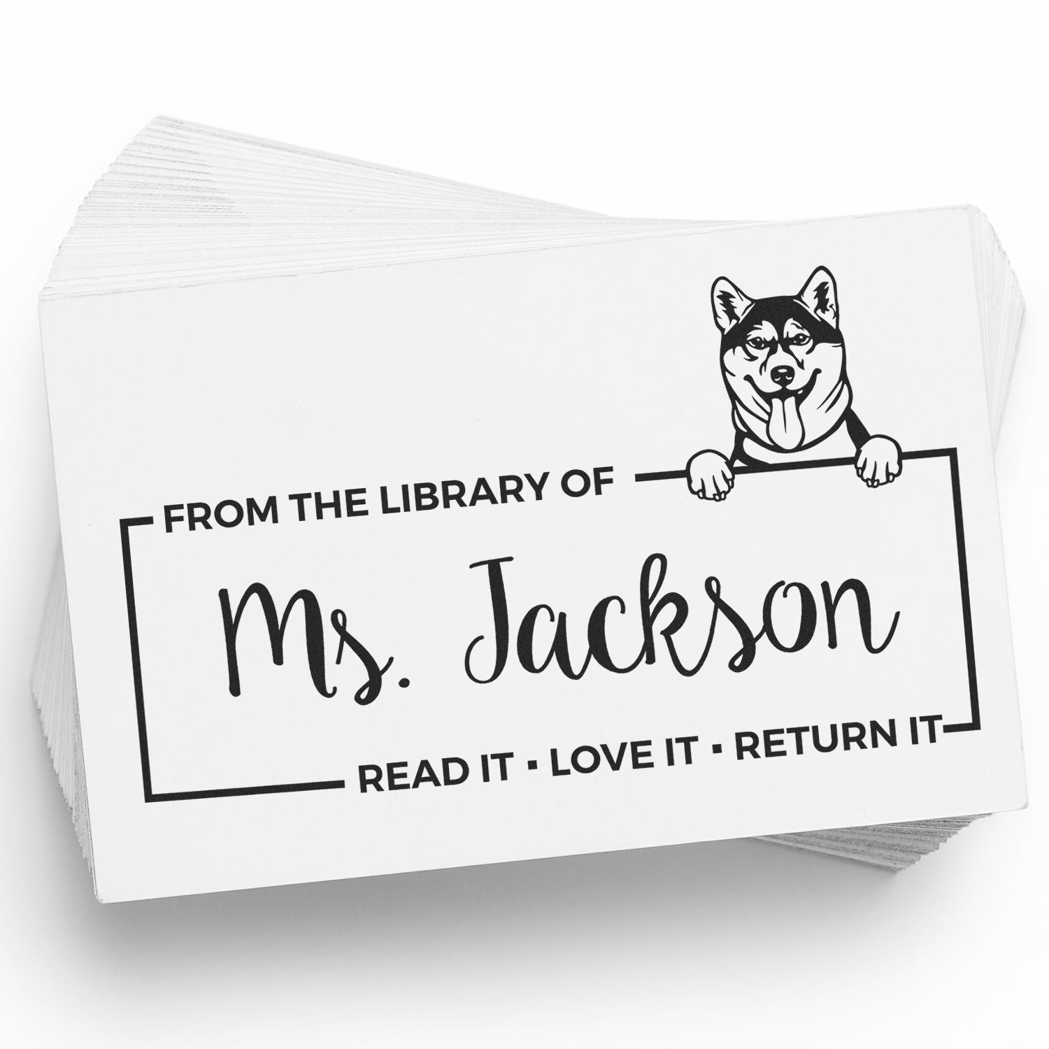 Custom library book rubber stamp with husky illustration and Ms. Jackson name, saying Read It, Love It, Return It.