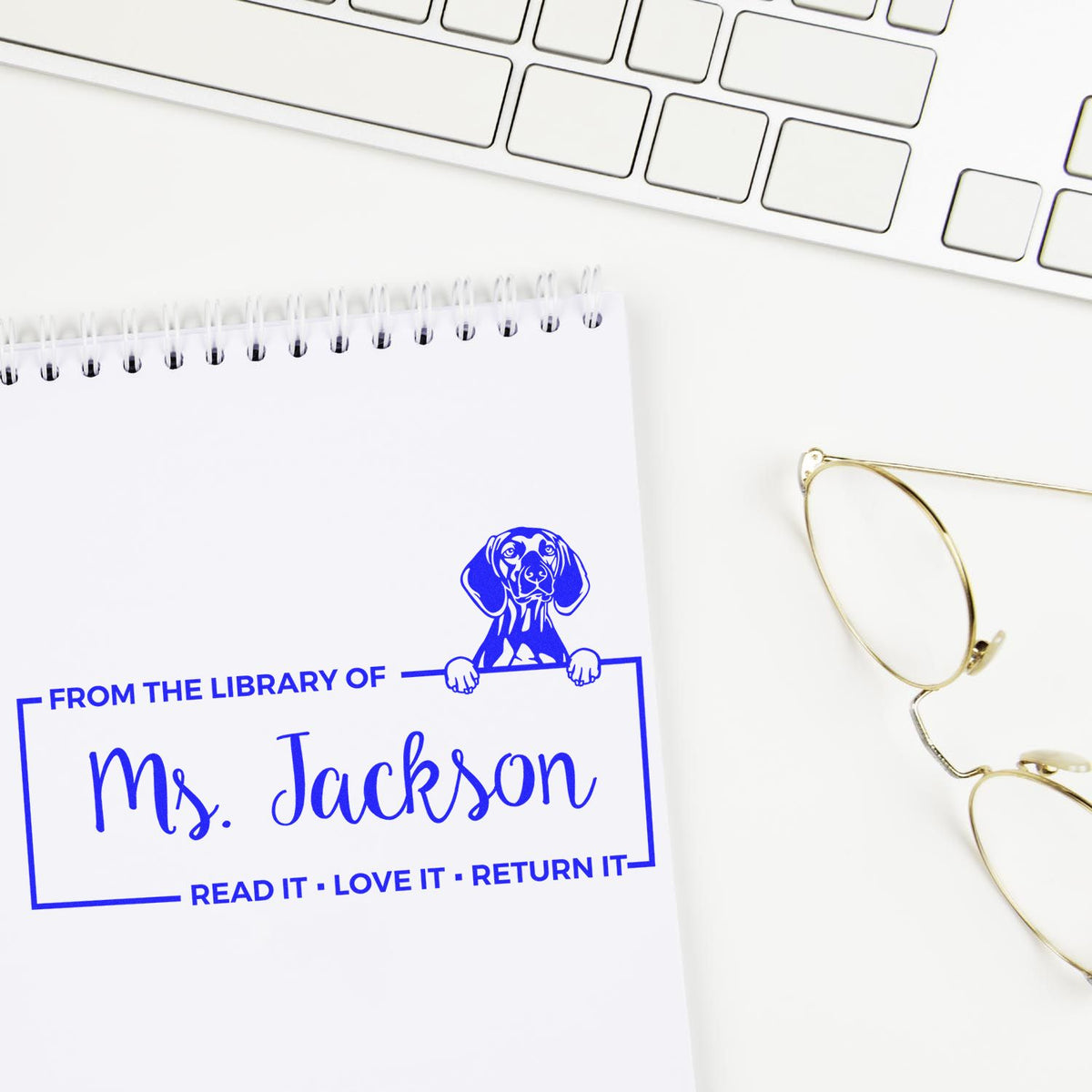 Personalized rubber library stamp for Ms. Jackson with dog design, ideal for marking classroom books and returns.