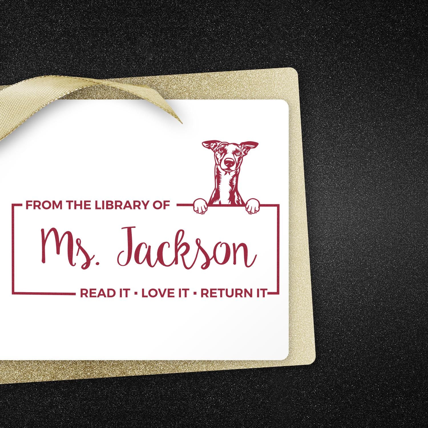 Personalized library rubber stamp for Ms. Jackson with dog bookplate and Read It, Love It, Return It text.