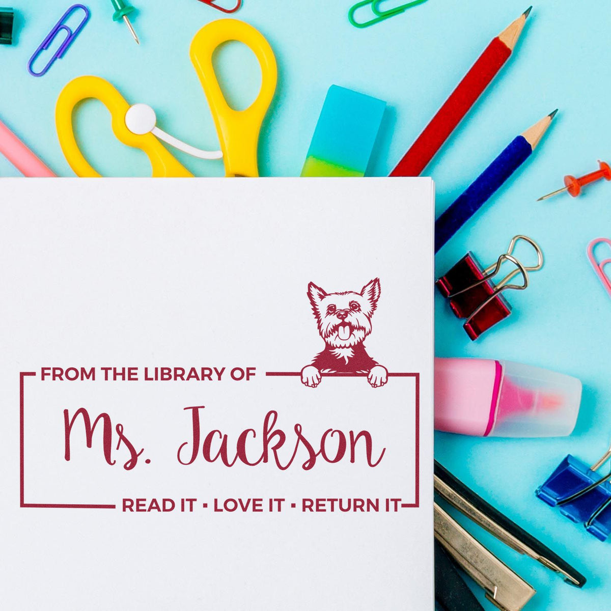 Personalized library rubber stamp with dog design for books, reading From the library of Ms. Jackson.