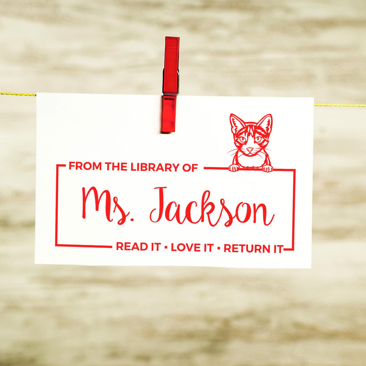 Custom rubber stamp for Ms. Jackson library books with cat design and Read It Love It Return It text