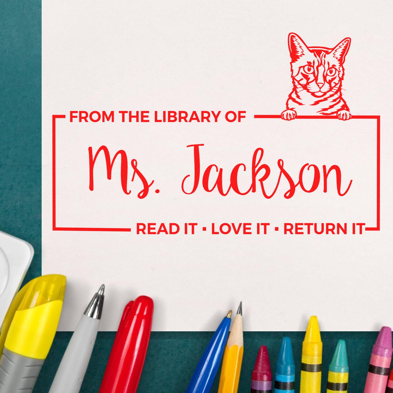 Custom library book stamp for Ms. Jackson with cat design and Read it, love it, return it message.
