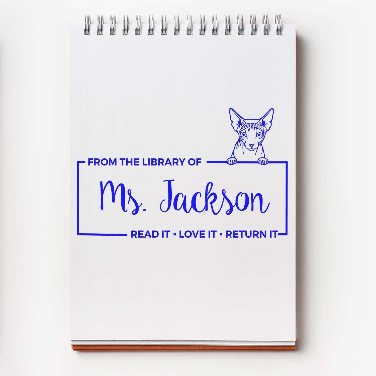 Custom rubber stamp design: From the Library of Ms. Jackson with cat art and Read It, Love It, Return It book label.