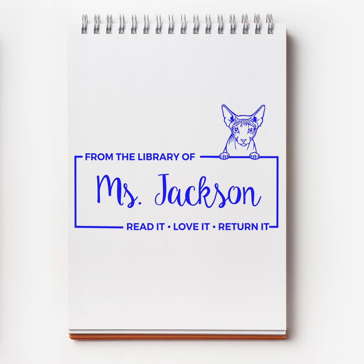 Custom library rubber stamp with cat design, personalized for Ms. Jackson, with Read it, Love it, Return it message.