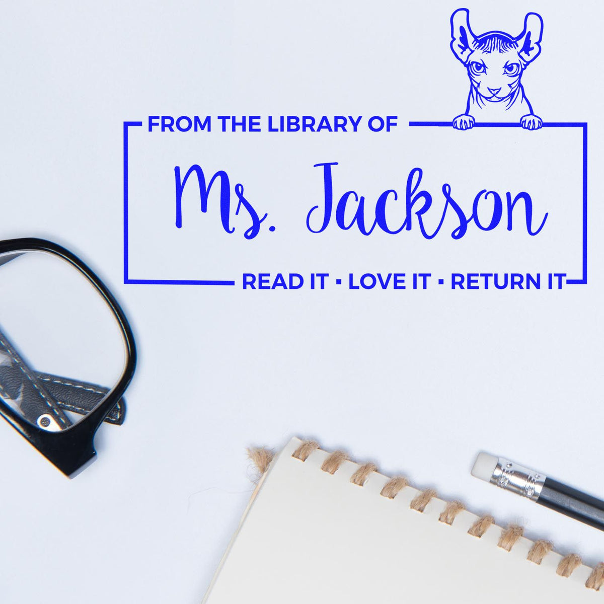 Personalized library rubber stamp for Ms. Jackson with cat design and Read It, Love It, Return It message