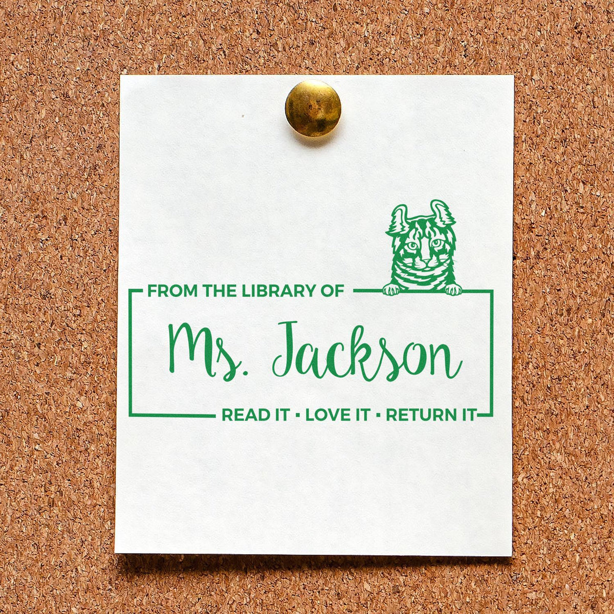 Personalized library rubber stamp for Ms. Jackson with cat design and Read It, Love It, Return It book return message.