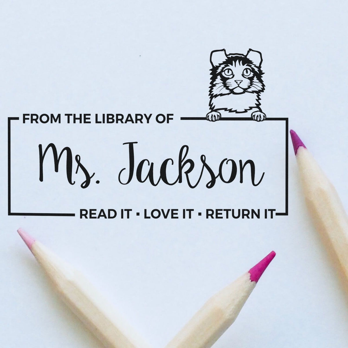 Personalized library rubber stamp for teachers with cat design and From the Library of Ms. Jackson read it, love it, return it.