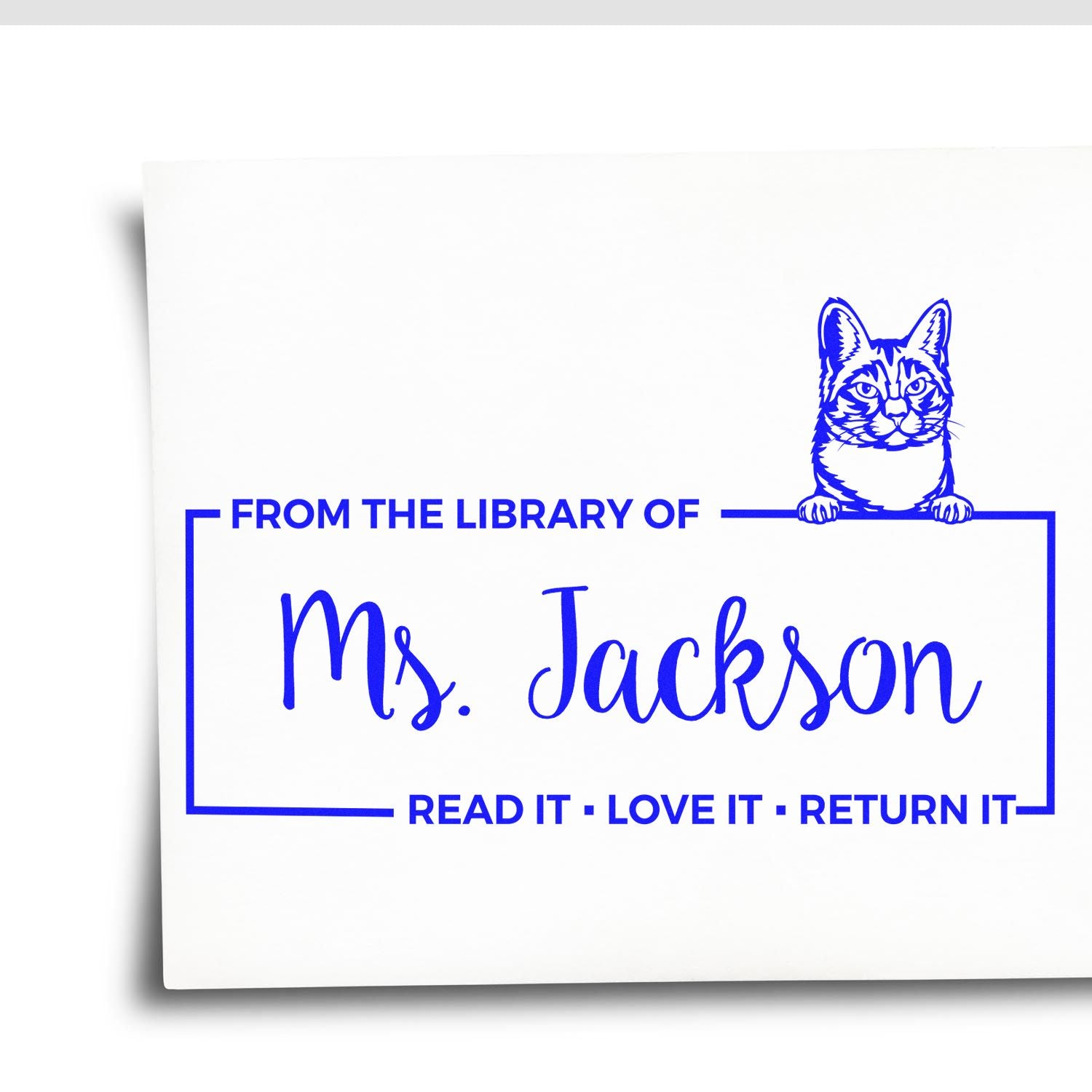 Custom library rubber stamp with cat, reading From the Library of Ms. Jackson and Read it, love it, return it.