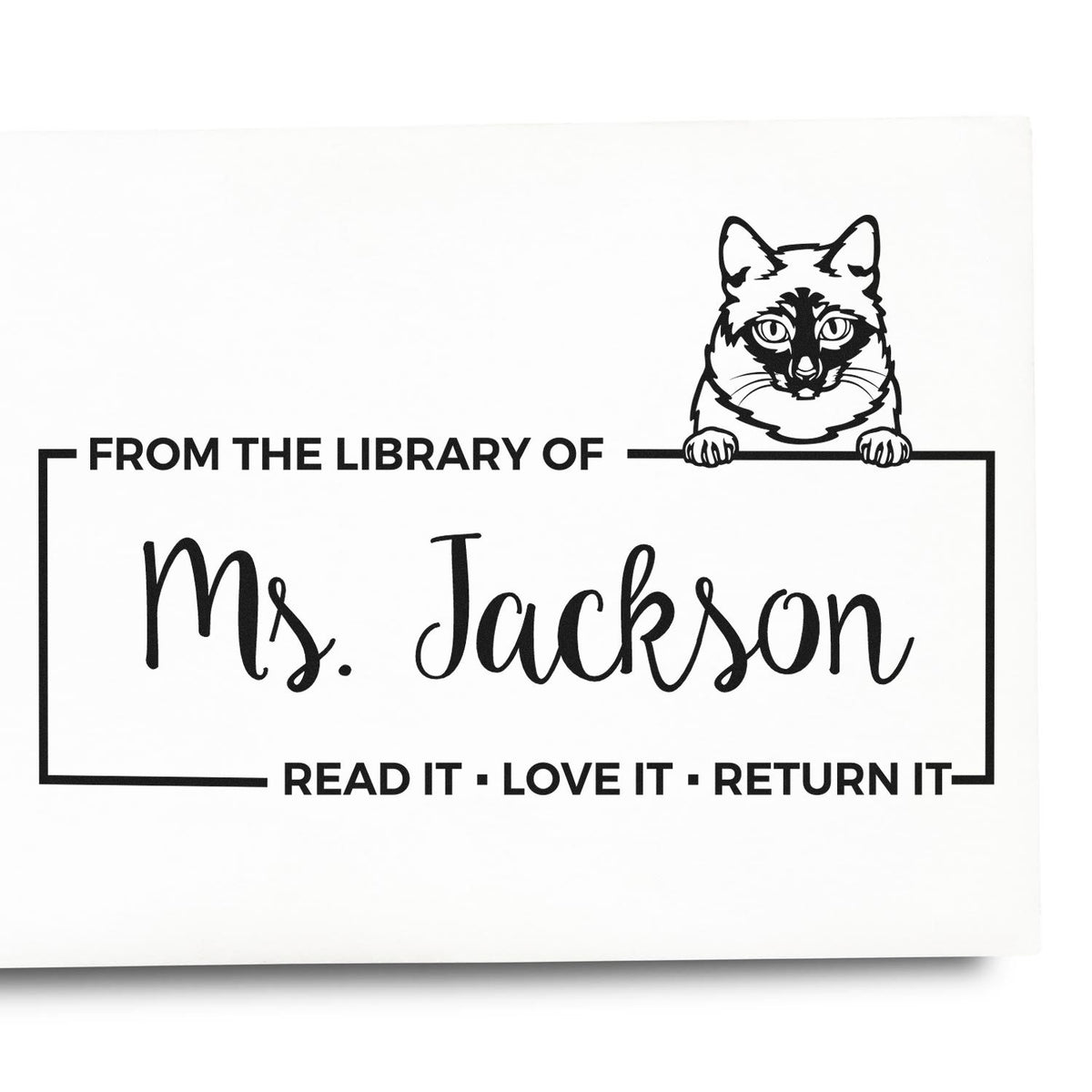 Custom library rubber stamp with cat design and bookplate text: From the Library of Ms. Jackson with Read it, love it, return it.