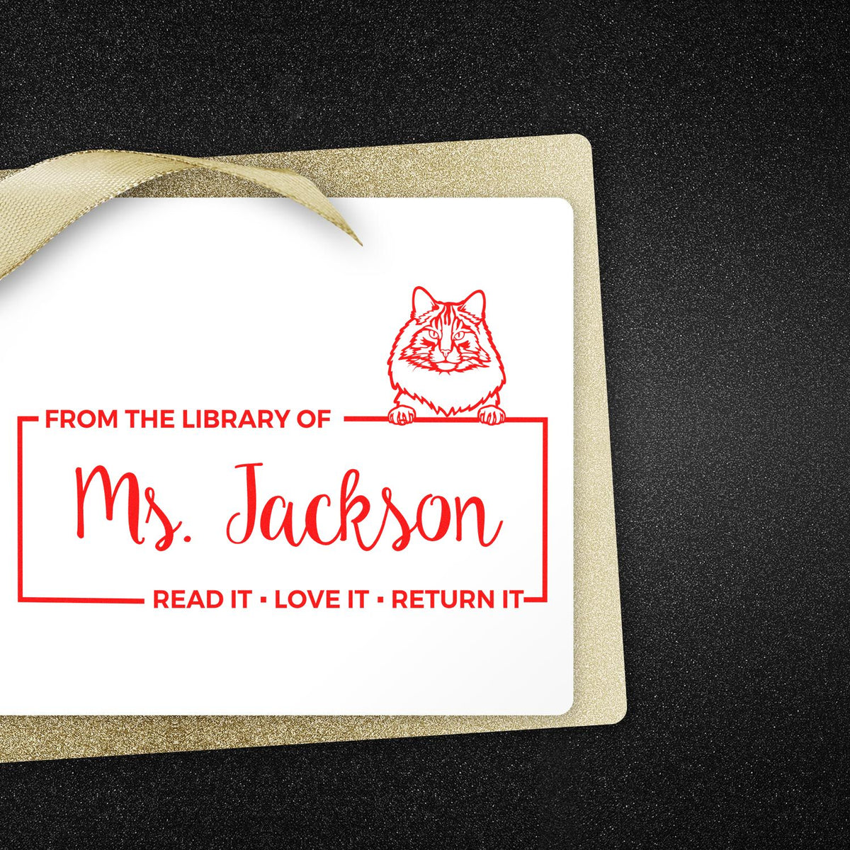 Personalized rubber library stamp with cat design, From the Library of Ms. Jackson, for custom book labeling.